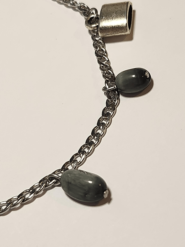 Bracelet breloque et œil de faucon